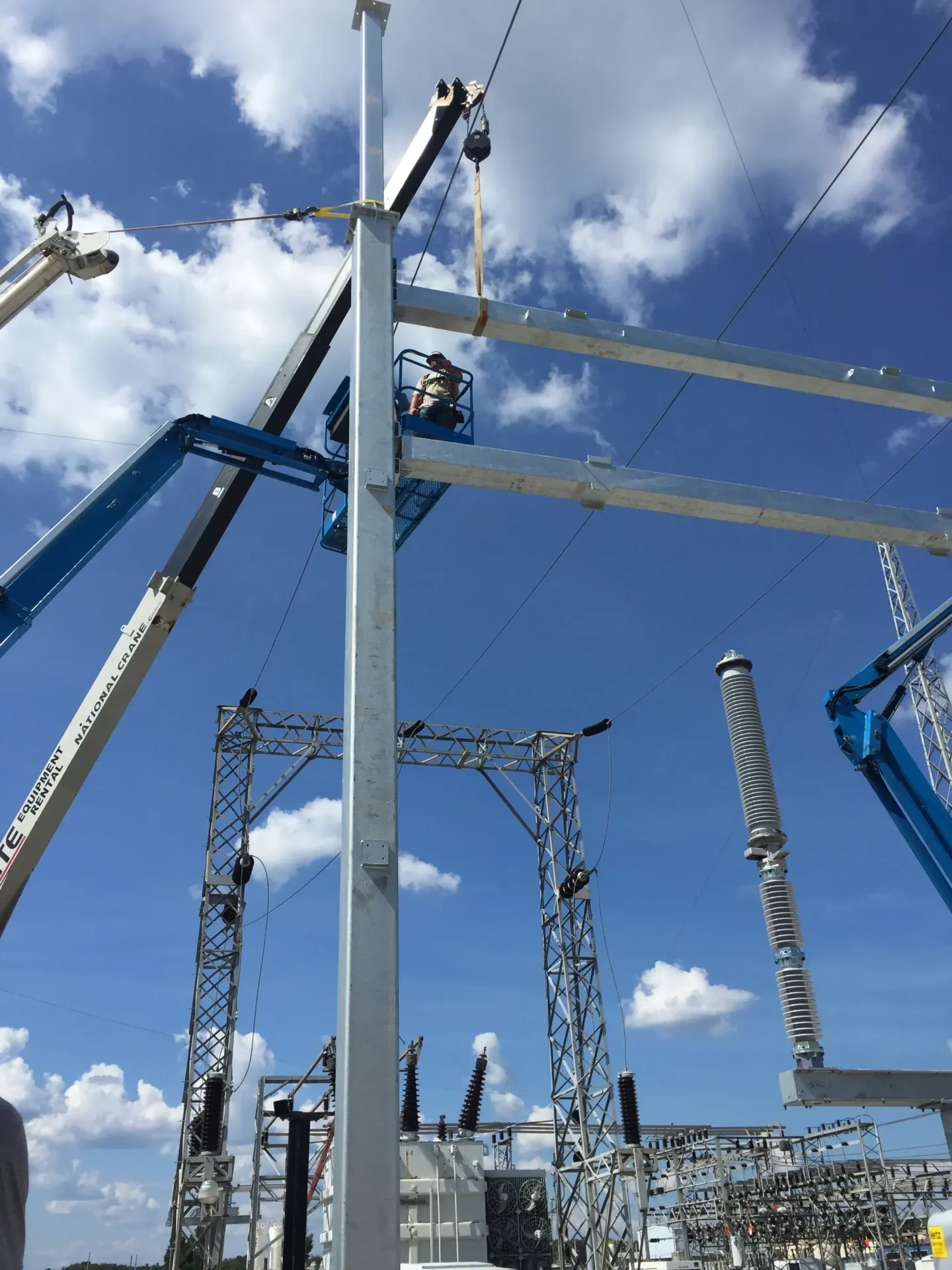 A group of people working on some structures.